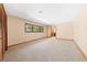 Large unfurnished carpeted bedroom with a window and closet at 2400 Llewellyn Dr, Las Vegas, NV 89102
