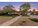 Charming home with a well-manicured front yard with mature trees and shrubbery at 2400 Llewellyn Dr, Las Vegas, NV 89102