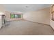 Spacious living room with large windows offering plenty of natural light and neutral decor at 2400 Llewellyn Dr, Las Vegas, NV 89102