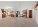 Open-concept living area featuring a brick fireplace and built-in shelves, perfect for entertaining at 2400 Llewellyn Dr, Las Vegas, NV 89102