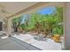 Covered backyard patio features palm trees and desert landscaping, offering a private outdoor space at 2839 Goldcreek St, Henderson, NV 89052