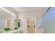 Bright bathroom with dual sinks, a walk-in shower, and a view into a closet at 2839 Goldcreek St, Henderson, NV 89052
