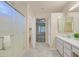 En-suite bathroom featuring a walk-in shower, double vanity, and access to the Primary bedroom at 2839 Goldcreek St, Henderson, NV 89052