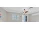 Well-lit bedroom featuring recessed lighting, ceiling fan, plantation shutters and sliding door access at 2839 Goldcreek St, Henderson, NV 89052