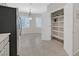 Dining area with pantry storage, black fridge and plantation shutters at 2839 Goldcreek St, Henderson, NV 89052