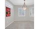 Dining area with modern light fixture, plantation shutters and grey walls at 2839 Goldcreek St, Henderson, NV 89052