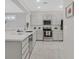 Modern kitchen featuring stainless steel appliances, light-colored countertops, and recessed lighting at 2839 Goldcreek St, Henderson, NV 89052