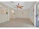 Spacious living room with tile flooring, a ceiling fan, and neutral paint colors at 2839 Goldcreek St, Henderson, NV 89052