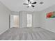 Spacious main bedroom with carpet, ceiling fan, and ensuite access at 2839 Goldcreek St, Henderson, NV 89052