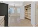 Bright breakfast nook featuring a pantry, tile flooring, and plantation shutters at 2839 Goldcreek St, Henderson, NV 89052