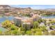 Elevated view showcasing the building near a lake, with trees at 29 Montelago Blvd # 131, Henderson, NV 89011