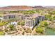 Stunning aerial perspective capturing a luxurious residential complex with lake and golf course views at 29 Montelago Blvd # 131, Henderson, NV 89011