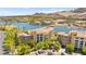 Scenic aerial view highlighting buildings, lake, and golf course at 29 Montelago Blvd # 131, Henderson, NV 89011