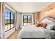 Comfortable bedroom with large windows offering lake views and plenty of natural light at 29 Montelago Blvd # 131, Henderson, NV 89011