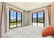 Inviting bedroom features two large windows with picturesque backyard and mountain views at 29 Montelago Blvd # 131, Henderson, NV 89011