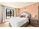 Bedroom showcasing a comfortable bed, natural lighting, and scenic outdoor views at 29 Montelago Blvd # 131, Henderson, NV 89011