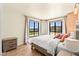 Bright bedroom featuring a bed and two windows with a view of the outdoors at 29 Montelago Blvd # 131, Henderson, NV 89011