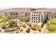 Multi-story building featuring well-maintained landscaping and community pool near the complex at 29 Montelago Blvd # 131, Henderson, NV 89011