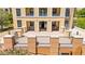 Exterior view of a building with a spacious patio, showcasing outdoor seating and beautiful landscaping in a relaxed setting at 29 Montelago Blvd # 131, Henderson, NV 89011