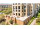Exterior view of a multi-story building featuring balconies, a patio, and landscaped grounds, highlighting the property's curb appeal at 29 Montelago Blvd # 131, Henderson, NV 89011