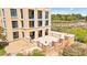 Exterior view of a building with a patio overlooking manicured lawns and trees, exemplifying outdoor enjoyment and curb appeal at 29 Montelago Blvd # 131, Henderson, NV 89011