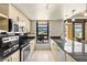 Modern kitchen featuring stainless steel appliances and a view of the outdoors at 29 Montelago Blvd # 131, Henderson, NV 89011