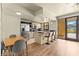 Eat-in kitchen features stainless steel appliances, black countertops, and a breakfast bar with seating at 29 Montelago Blvd # 131, Henderson, NV 89011