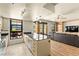 Open-concept kitchen with island and adjacent living area at 29 Montelago Blvd # 131, Henderson, NV 89011