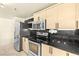 Contemporary kitchen with stainless steel appliances and sleek countertops at 29 Montelago Blvd # 131, Henderson, NV 89011
