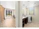 Spacious laundry room featuring a sink, modern washer and dryer, and great natural light at 29 Montelago Blvd # 131, Henderson, NV 89011