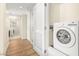 Convenient laundry room with washer, dryer, and built-in storage for easy chore days at 29 Montelago Blvd # 131, Henderson, NV 89011