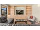 Inviting living room features custom built-ins, plush seating, and a stylish stone-top coffee table at 29 Montelago Blvd # 131, Henderson, NV 89011