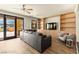 Spacious living room featuring a built-in entertainment center and sliding glass doors to a balcony with scenic views at 29 Montelago Blvd # 131, Henderson, NV 89011