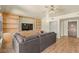 Relax in this living room featuring custom built-ins, modern lighting, and comfortable seating at 29 Montelago Blvd # 131, Henderson, NV 89011