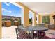Spacious patio with outdoor dining set and comfortable seating, offering stunning views of the landscape at 29 Montelago Blvd # 131, Henderson, NV 89011