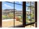 Beautiful view of the mountains, lake, and community from a large window at 29 Montelago Blvd # 131, Henderson, NV 89011