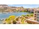 Scenic waterfront view overlooking a lake with surrounding buildings and greenery, showcasing the property's ideal location at 29 Montelago Blvd # 131, Henderson, NV 89011