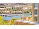 Scenic waterfront view of a European style village, featuring multiple buildings, a harbor, and a lake at 29 Montelago Blvd # 131, Henderson, NV 89011