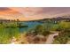 Picturesque waterfront view showcasing serene lake scenery and lush landscaping at 29 Montelago Blvd # 131, Henderson, NV 89011