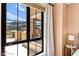 This window captures views of the balcony, community, surrounding buildings, and mountains at 29 Montelago Blvd # 131, Henderson, NV 89011