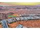 Aerial view of homes nestled in the mountains with the address tag at 32 Tatahatso Point Street at 32 Tatahatso Point St, Henderson, NV 89011