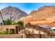 Backyard view with mountain views, desert landscaping and a tranquil private retreat at 32 Tatahatso Point St, Henderson, NV 89011