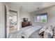 Bedroom with carpeted floors, walk-in closet, and large window at 32 Tatahatso Point St, Henderson, NV 89011