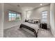 Bright bedroom with carpeted floors and large windows at 32 Tatahatso Point St, Henderson, NV 89011