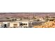 Desert community view showcasing modern homes nestled in a mountain setting at 32 Tatahatso Point St, Henderson, NV 89011