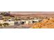 Stunning view of modern homes nestled in a desert landscape, offering a luxurious lifestyle at 32 Tatahatso Point St, Henderson, NV 89011