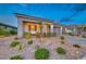 Charming single-story home with a covered porch and desert landscaping in a quiet neighborhood at 32 Tatahatso Point St, Henderson, NV 89011