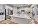 Modern kitchen with a large island and stainless steel appliances at 32 Tatahatso Point St, Henderson, NV 89011