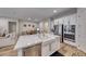Open kitchen with large island and stainless steel appliances at 32 Tatahatso Point St, Henderson, NV 89011