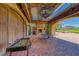 Covered outdoor entertaining area complete with fireplace and a view of the golf course at 32 Tatahatso Point St, Henderson, NV 89011